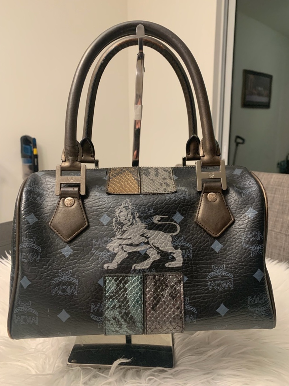MCM Black Leather Satchel with Metallic Lion Graphic